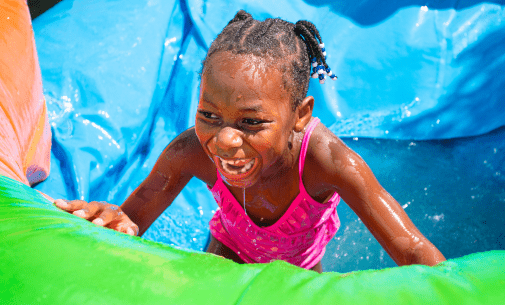 kid playing on inflatable
