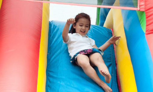 Little girl enjoying the slide