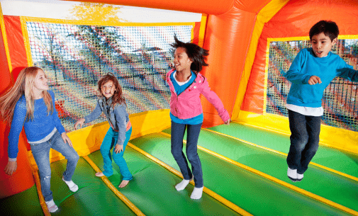 kids playing in bounce house