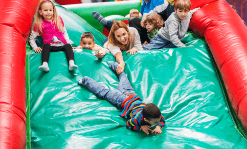 kids on inflatable slides