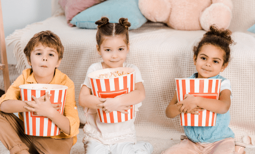 kids holding popcorn